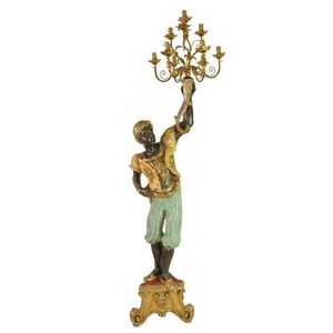 A polychrome painted, gilt and silvered Blackamoor figure with…
