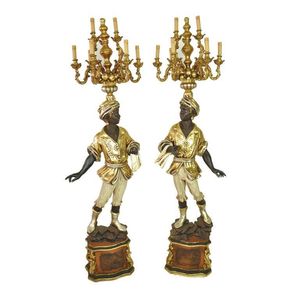 A pair of silvered gilt and polychrome painted Blackamoor…