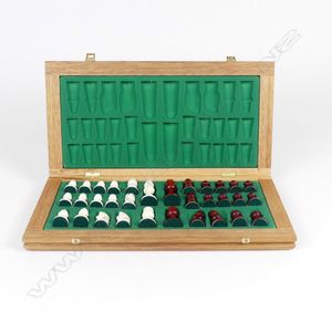 A boxed ivory chess set, Staunton design, the box opens out to…