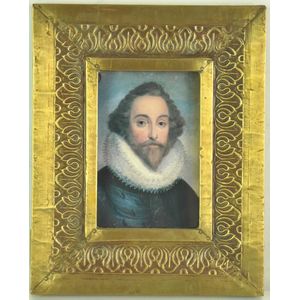 A repousse brass picture frame with enclosed print 25 x 20 cm