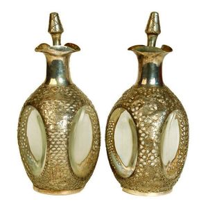 A pair of silver overlaid Haig's 'Pinch' whisky bottles, the…