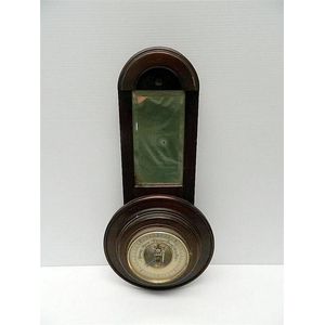 A C1930 barometer by Shortland with mirrored panel 51.5 cm long