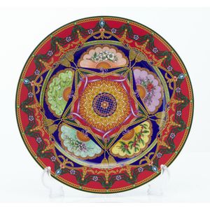 A porcelain 2005 Christmas peace plate by Versace, made by…