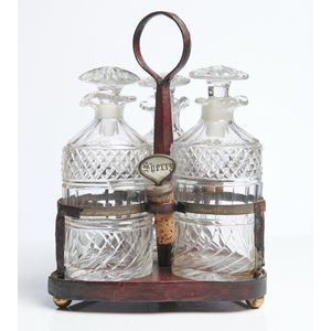 Three bottle sets on stands, early 19th century, comprising two…