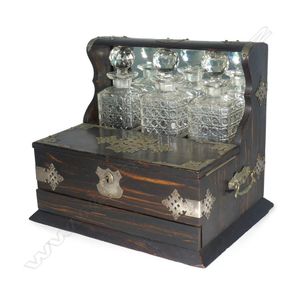 A Victorian Coromandel wood combination tantalus, the three…