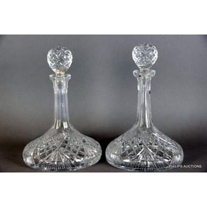 A pair of cut glass ship's decanters, 20th century, with cross…