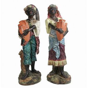 German Majolica blackamoor figures of water carriers. Height 67…