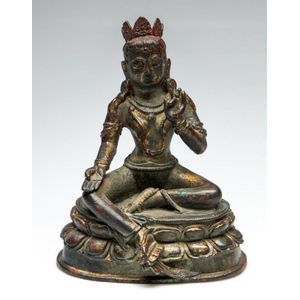 A bronze Chinese Tara seated on lotus base, height 19 cm