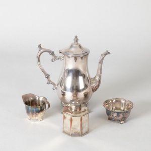 A silver plated teapot, includes three other pieces of silver…