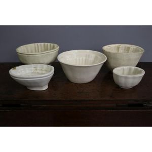 Five antique pottery jelly moulds, 10 cm high, and smaller (5)