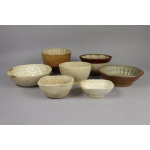 Seven antique and later pottery jelly moulds, 11 cm high, &…