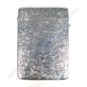 A late Victorian silver card case, the exterior profusely…
