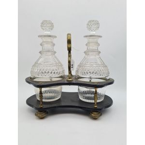 Gerogian tantalus, two crystal decanters with ebonised and…