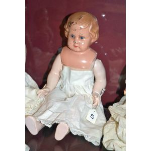 'Minerva' German 15 inch metal head doll with blue glass eyes,…