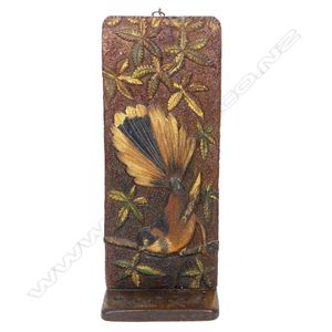 An uncommon Jane Brenkley pipe rack, carved in high relief with…