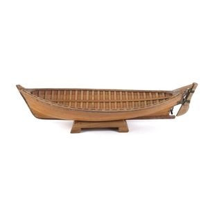 A clinker model boat made from huon pine boards with copper…