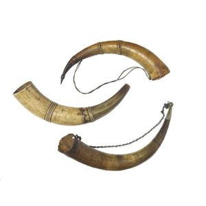 Three scrimshaw powder horns, 19th century, with naive incised…