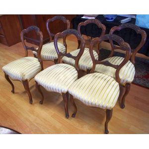 Six Victorian walnut balloon back chairs