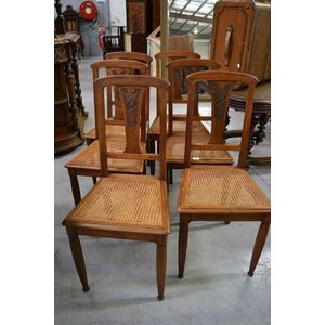 Six French Art Deco walnut chairs, carved with pomegranates (6)