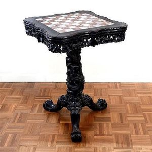 An early 20th Chinese carved rosewood chess table on tripod…