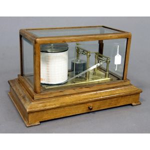 An English barograph in oak framed glass panelled case. Number…