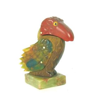 An unusual multi coloured bakelite lighter in the form of a…