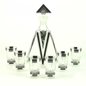 A seven piece Art Deco black enamel and cut glass liqueur set,…