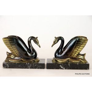 A pair of Art Deco spelter swan bookends, circa 1930, in gold…