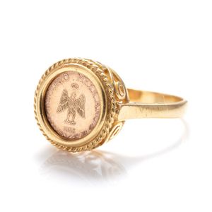 An 18ct gold coin ring, set with a 9ct gold 1865 Mexican…