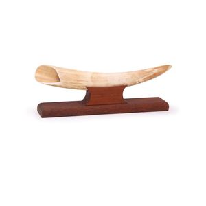 A walrus tusk. Highly polished on wooden stand. Length 35 cm