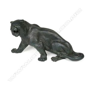 A 19th century bronze tiger, in semi recumbent snarling pose,…