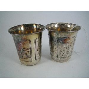 A pair of Russian silver beakers, engraved townscape and…