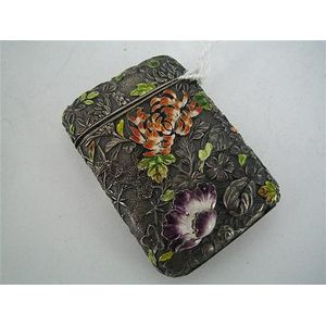 A Japanese enamel match case, foliate relief decoration