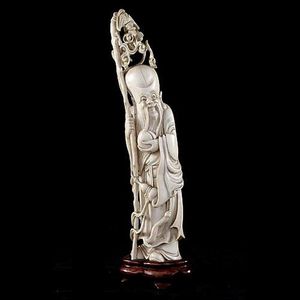 A Chinese Carved Ivory figure of Shou Lao and timber stand.&hellip;