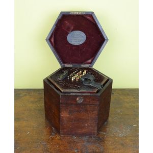 An accordion by Lachenal & Co., London in mahogany case. 18 cm…