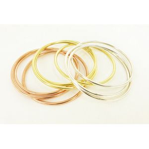 Three Russian silver bangles, including two gold plated. Weight…