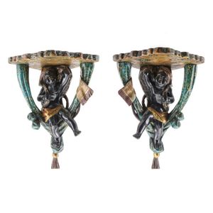 A pair of polychrome painted blackamoor figural wall brackets,…