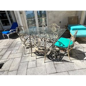 An Italian ornate cast metal glass top patio table and eight…