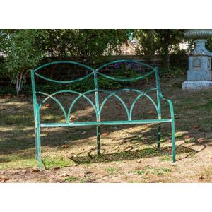 A green painted metal garden seat 132 cm wide, 98 cm high, 54…