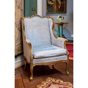 19th century French Louis XV style gilded wing chair.