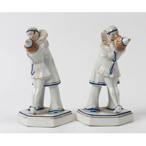 A pair of German porcelain Pierrot figural bookends, stamped…
