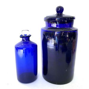 A cobalt lidded glass apothecary bottle and a matching ink…