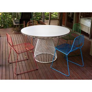 An outdoor table and four coloured chairs by Tait, 74 cm high,…
