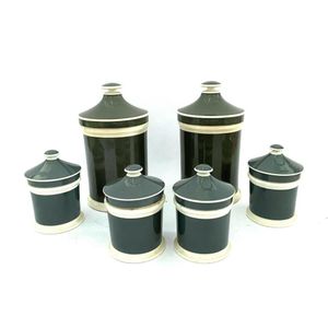 A collection of Victoria green and cream ceramic apothecary…