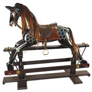 A modern Victorian style rocking horse, glossy black and dapple…