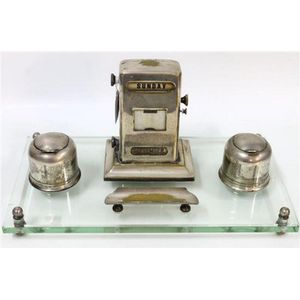An English made desk set with date display, pen rest and two…