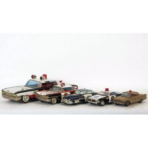 Police Cars: Group of tinplate toy Police cars, varying sizes…
