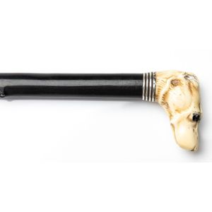 A VICTORIAN IVORY JANUS-HEADED BAMBOO WALKING CANE the pommel carved with  two grotesque back to ba