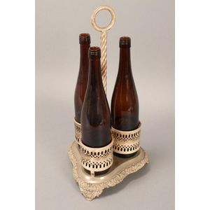 Silverplate three bottle tantalus, with central loop handle set…