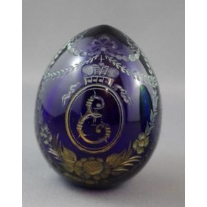 Faberge deep blue glass egg, with gilt decoration depicting an…